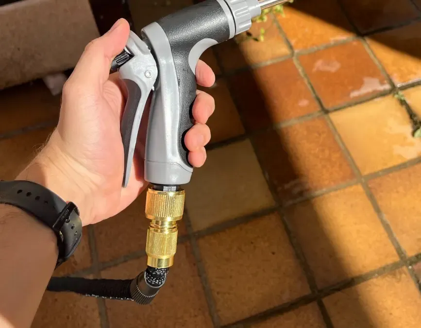Qinux WaterBlitz cleaning a car wheel